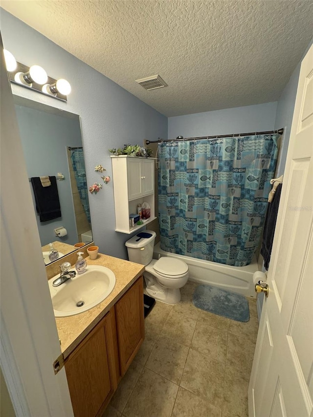 full bathroom with tile patterned floors, toilet, shower / tub combo, a textured ceiling, and vanity