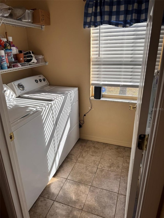 laundry area featuring independent washer and dryer and light tile patterned floors