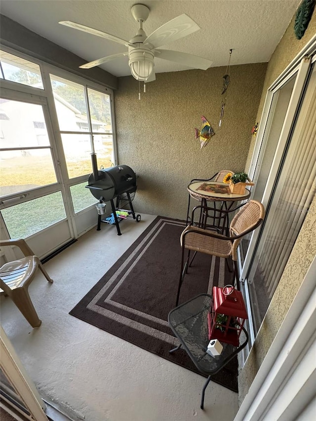 sunroom / solarium with ceiling fan