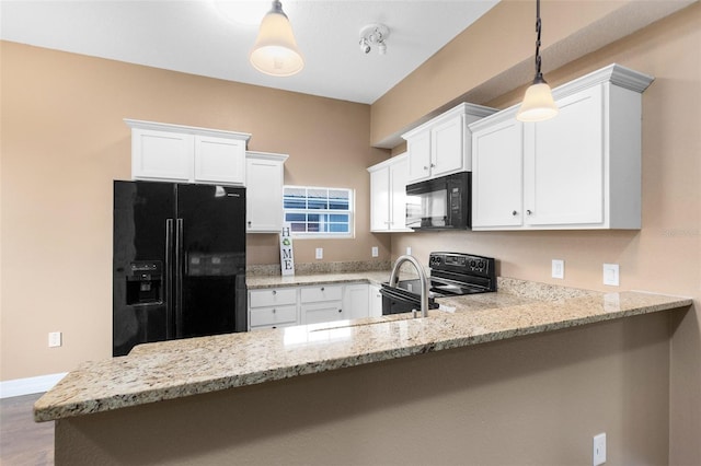 kitchen with white cabinetry, pendant lighting, kitchen peninsula, and black appliances