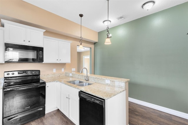 kitchen with sink, black appliances, white cabinets, decorative light fixtures, and kitchen peninsula