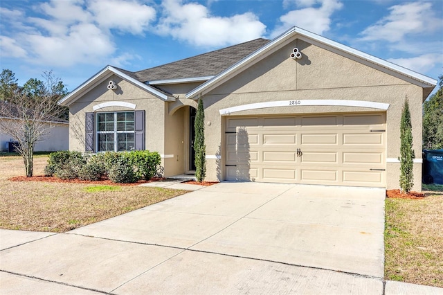 ranch-style house with a garage and a front lawn