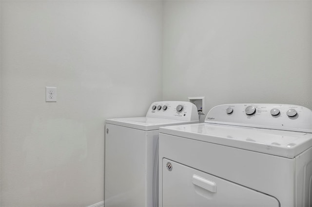 laundry room with washing machine and clothes dryer