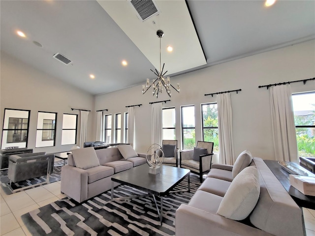 tiled living room with lofted ceiling, a wealth of natural light, and an inviting chandelier