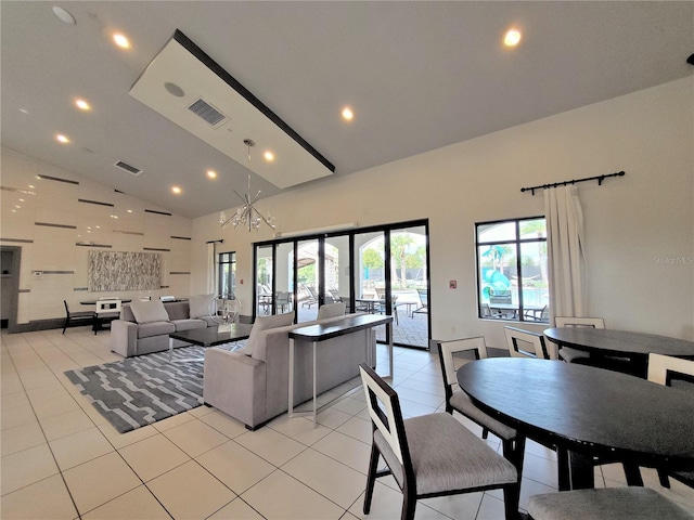 tiled dining room with high vaulted ceiling