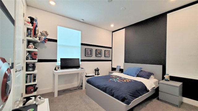 bedroom featuring light colored carpet