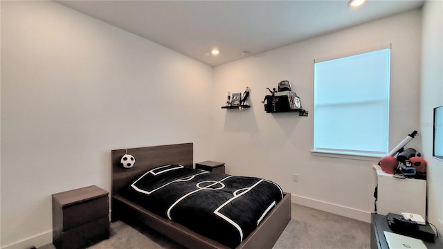 bedroom with light colored carpet