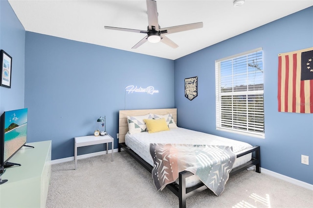 carpeted bedroom featuring ceiling fan