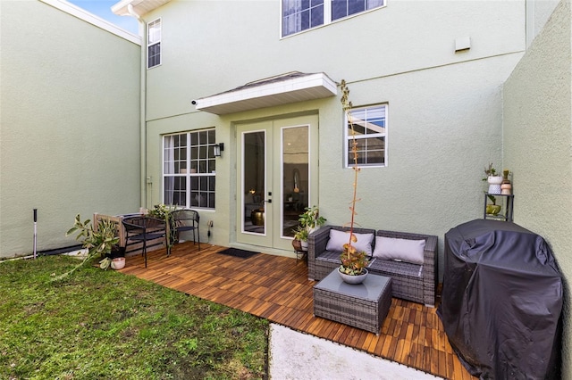 exterior space with a grill, french doors, and a deck