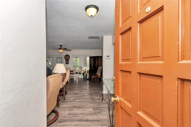 entrance foyer with wood-type flooring and ceiling fan