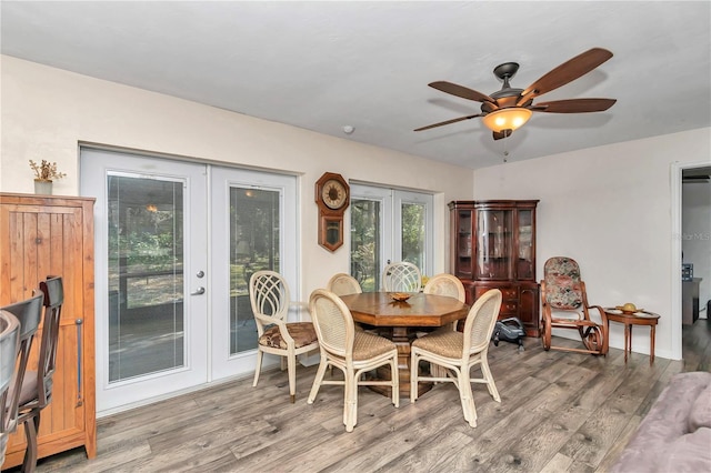 dining area featuring light hardwood / wood-style flooring, french doors, and ceiling fan