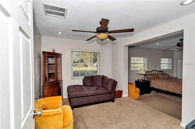 interior space with ceiling fan