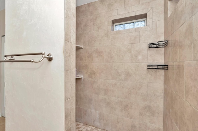 bathroom featuring tiled shower