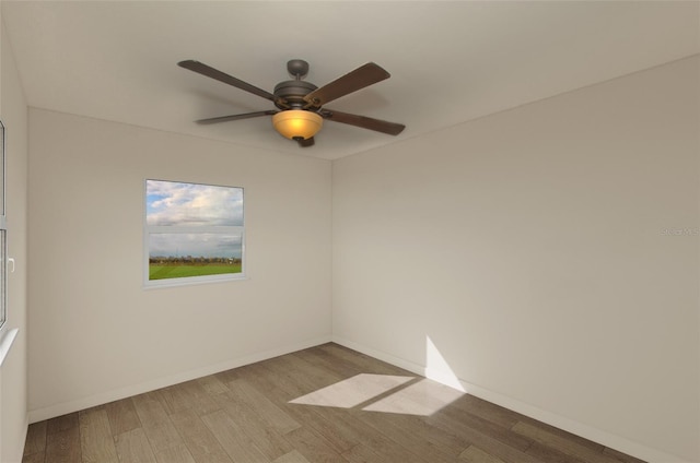 empty room featuring light hardwood / wood-style flooring and ceiling fan