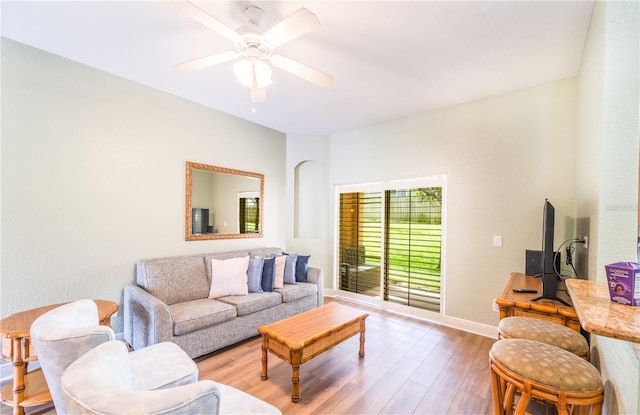 living room with ceiling fan and hardwood / wood-style floors