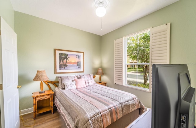 bedroom with hardwood / wood-style floors