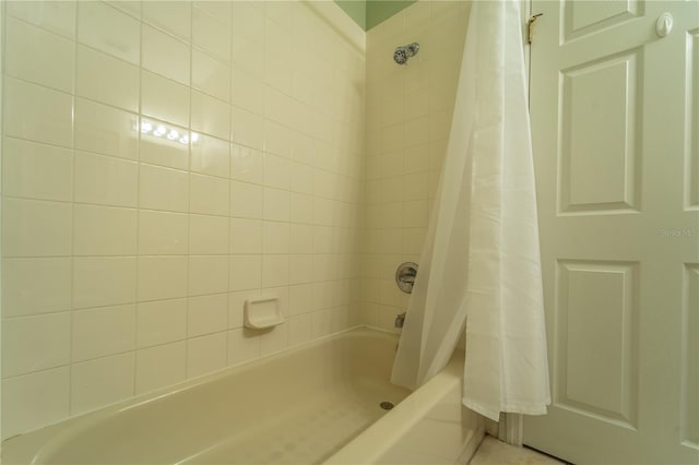 bathroom with shower / bathtub combination with curtain