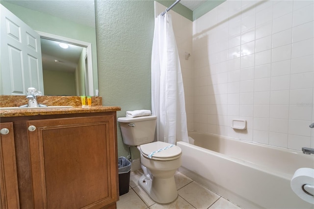 full bathroom with tile patterned floors, toilet, vanity, and shower / bath combo