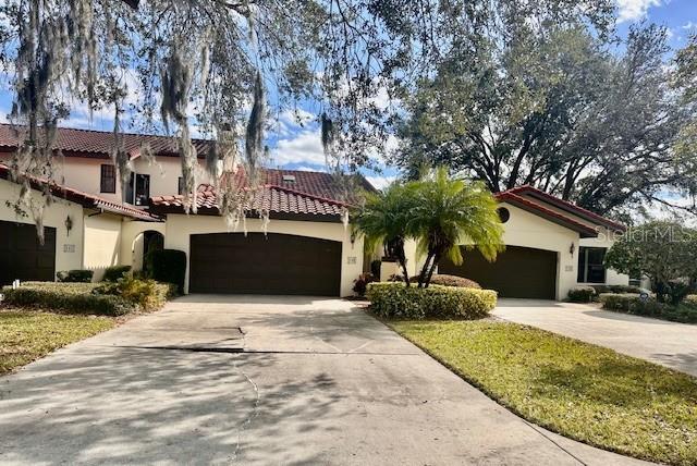 mediterranean / spanish-style home featuring a garage