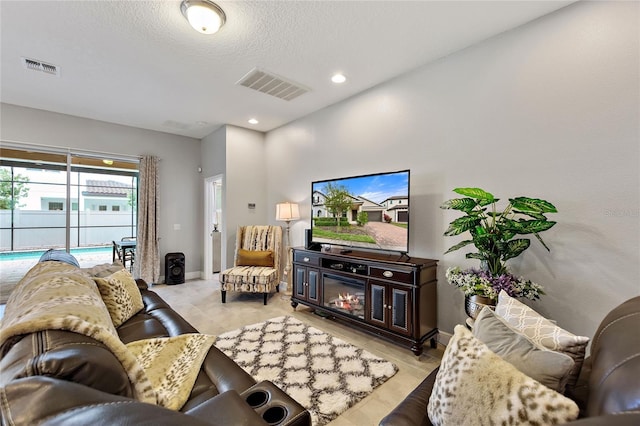 living room with a textured ceiling