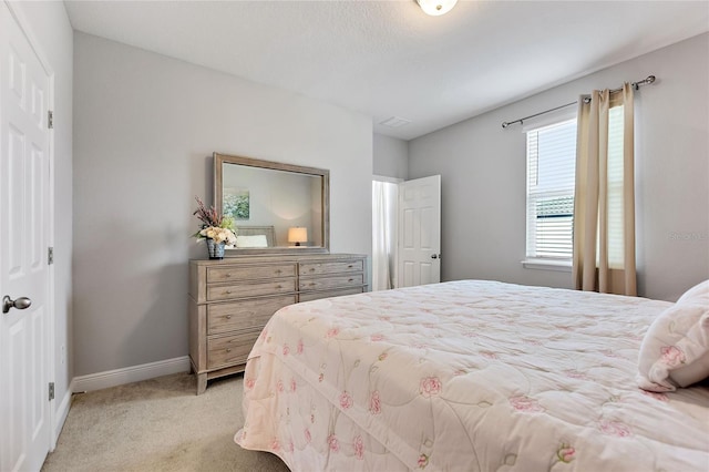 bedroom with light carpet