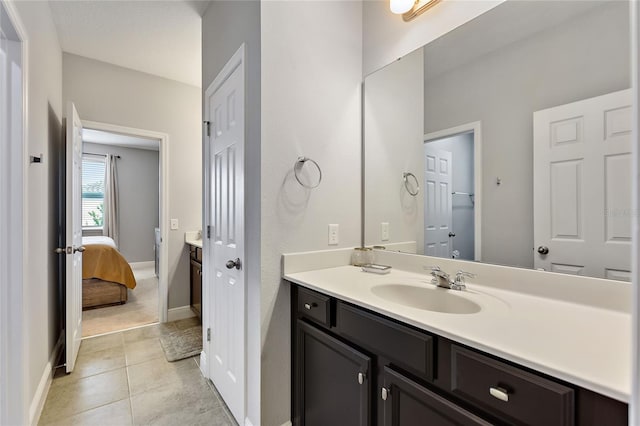 bathroom featuring vanity and tile patterned flooring