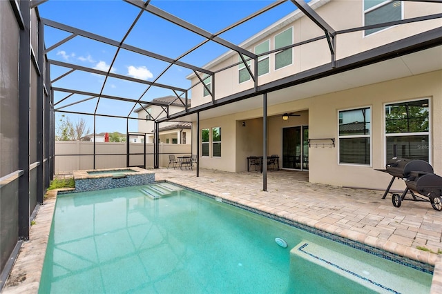 view of swimming pool featuring a lanai, a patio, and an in ground hot tub