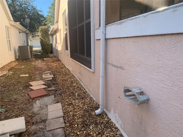 view of property exterior with cooling unit