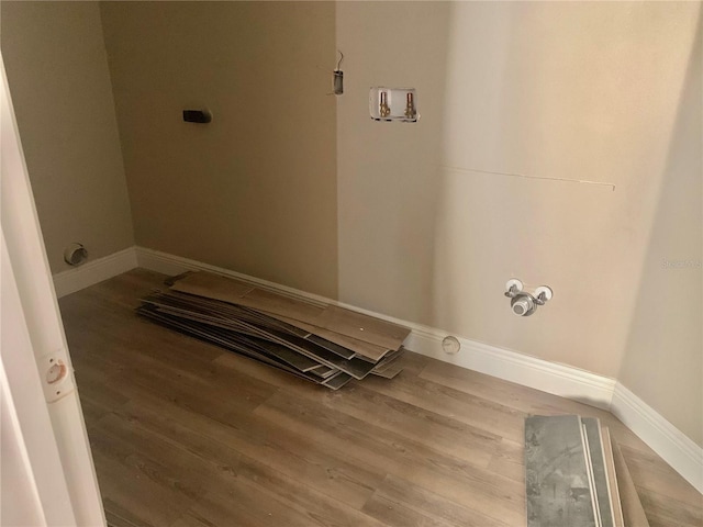 laundry area featuring wood-type flooring and hookup for a washing machine