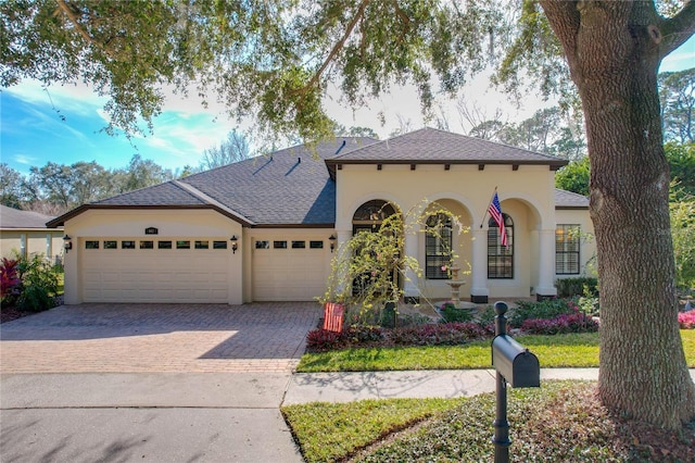 view of front of home with a garage