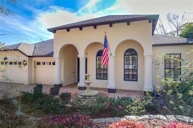 mediterranean / spanish-style home with a garage