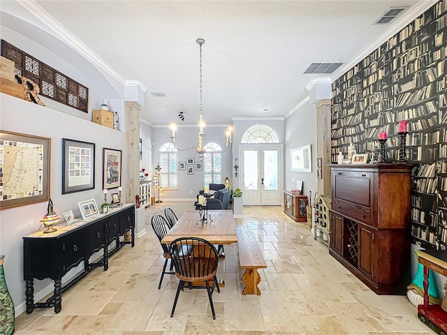 dining space featuring french doors and ornamental molding