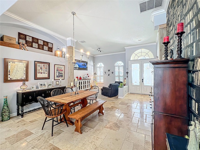 dining space featuring french doors, ornamental molding, and a notable chandelier