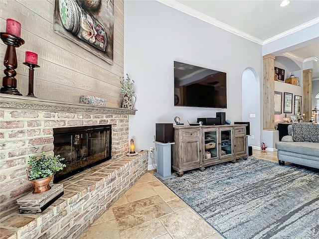 living room featuring crown molding and a brick fireplace