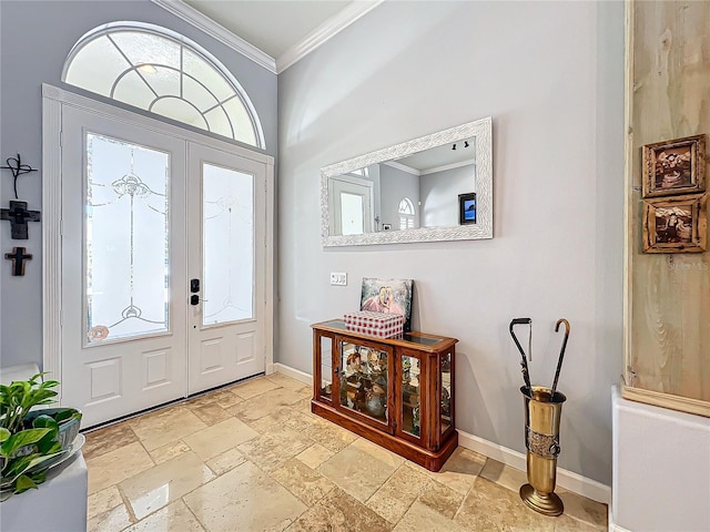 foyer featuring ornamental molding and french doors