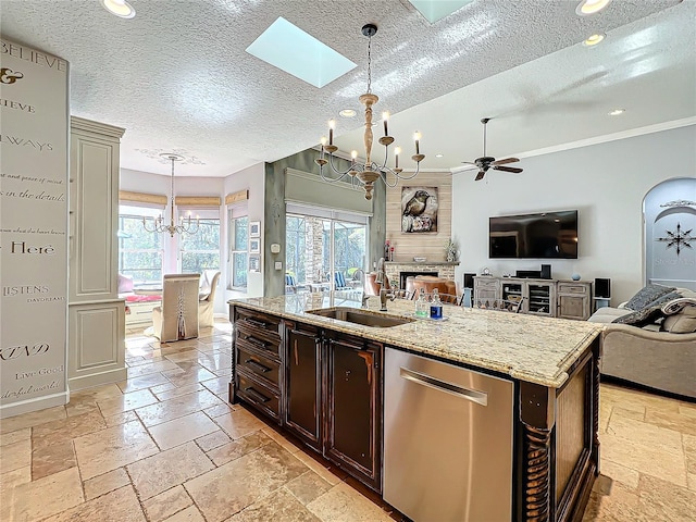 kitchen with dark brown cabinetry, sink, hanging light fixtures, a center island with sink, and stainless steel dishwasher