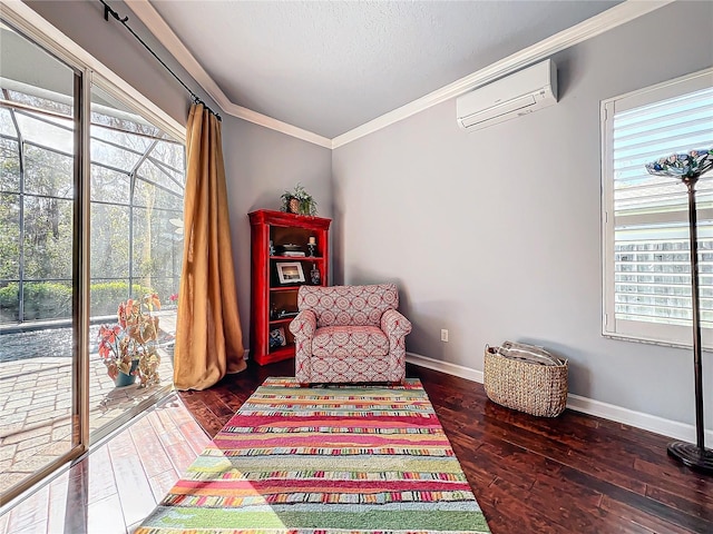 sitting room with crown molding, a healthy amount of sunlight, dark wood-type flooring, and a wall unit AC