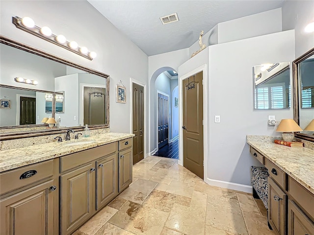 bathroom featuring vanity and a textured ceiling