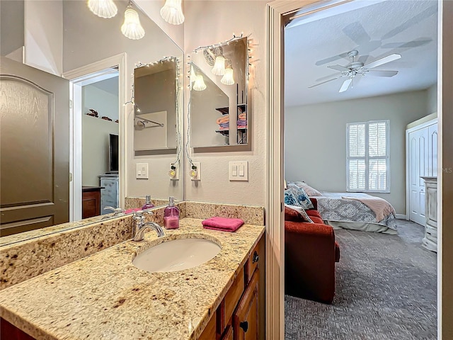 bathroom featuring vanity and ceiling fan