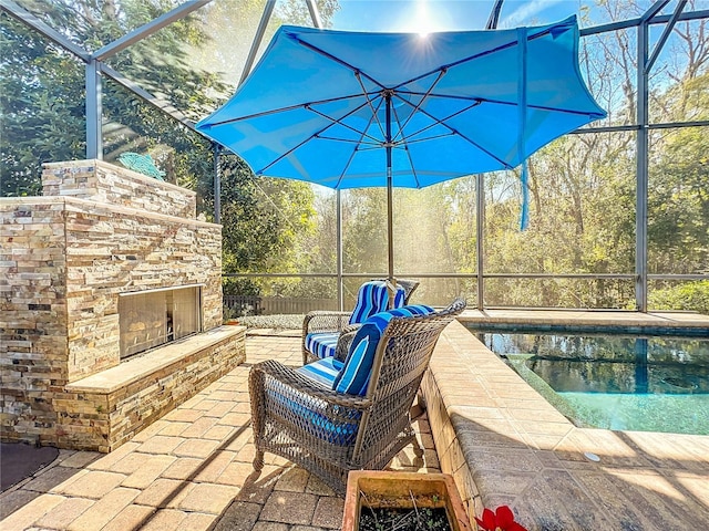 view of patio featuring an outdoor stone fireplace