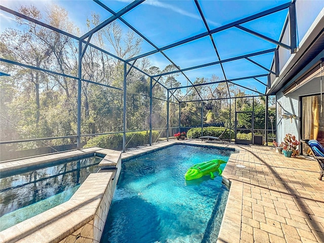 view of pool featuring a lanai and a patio