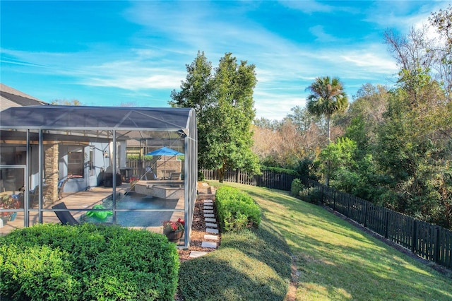 view of yard with a lanai and a patio