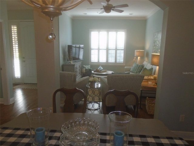 dining area featuring ornamental molding, dark hardwood / wood-style floors, and ceiling fan