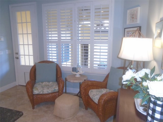 sitting room with tile patterned flooring