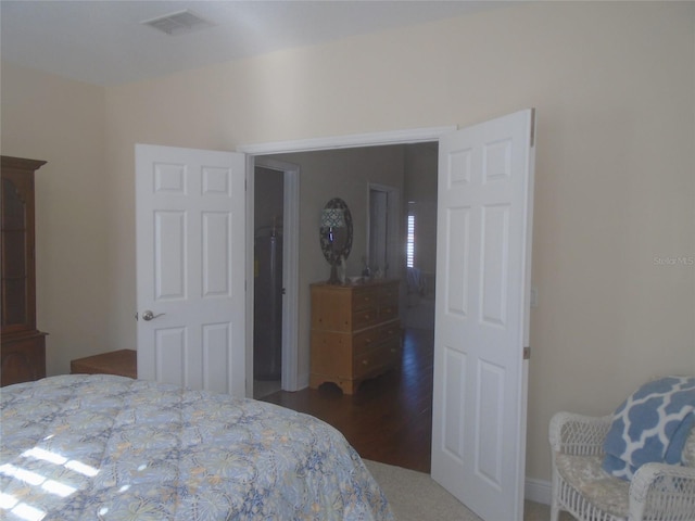 bedroom featuring dark hardwood / wood-style floors