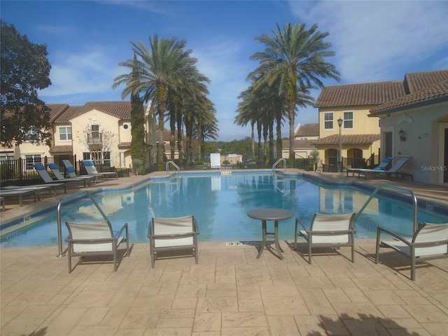 view of swimming pool featuring a patio