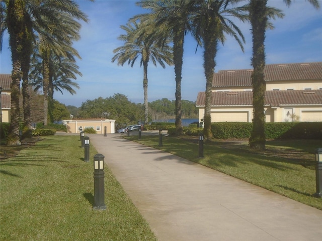 view of home's community with a lawn