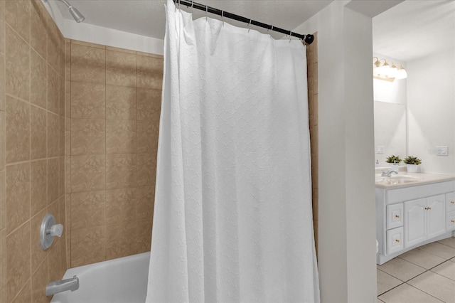 bathroom with shower / tub combo, vanity, and tile patterned flooring