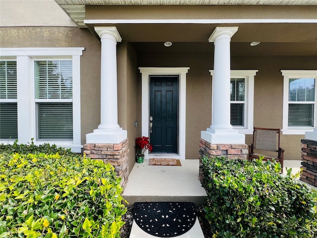 doorway to property with a porch