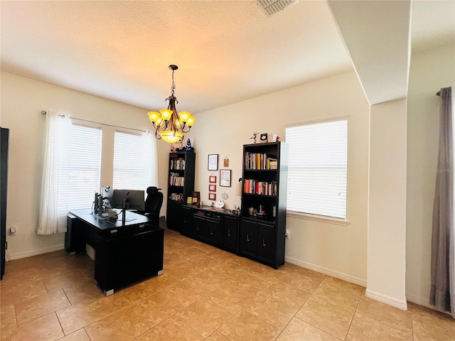 office space featuring an inviting chandelier